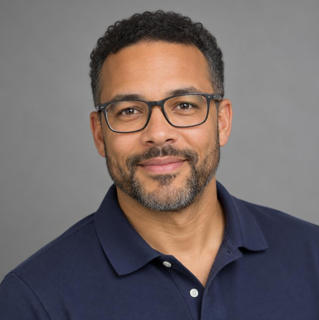 Portrait of a mixed race broadcast engineer wearing glasses